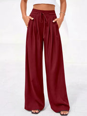 Burgundy high-waisted pleated pants with drawstring and pockets
