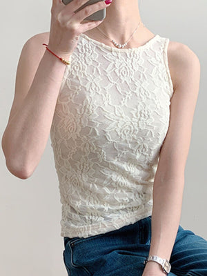 Sheer lace tank top in beige with floral pattern and round neckline.