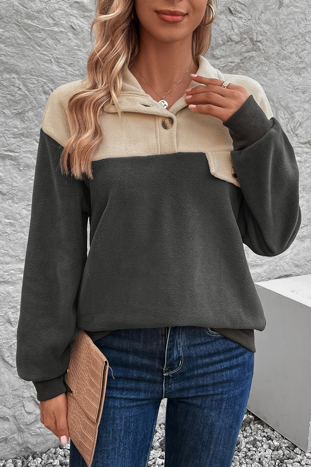 Colorblock fleece button-up pullover in dark gray and beige with a quarter-zip neckline and button details.