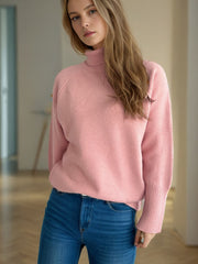 Dusty pink ribbed turtleneck sweater with ribbed cuffs and hem.