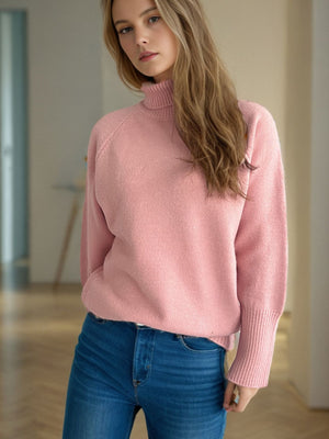 Dusty pink ribbed turtleneck sweater with ribbed cuffs and hem.