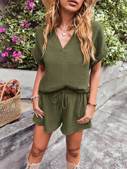 Textured cotton drawstring shorts in moss green with a relaxed fit and cuffed hem.