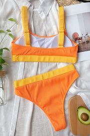 Ribbed orange and yellow high-waist bikini set with colorblock detail.