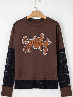 Brown cotton t-shirt with sequin spooky graphic and black lace sleeves and hem.