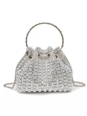 Silver rhinestone embellished mini crossbody bucket bag with chain strap and circular handle.