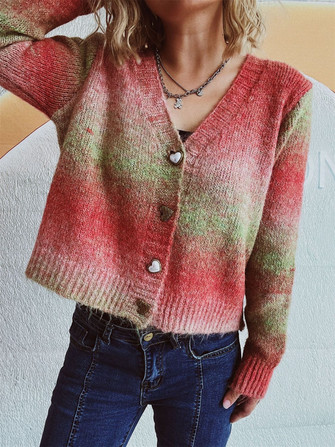 Ombre knit cardigan with heart buttons and V-neck.