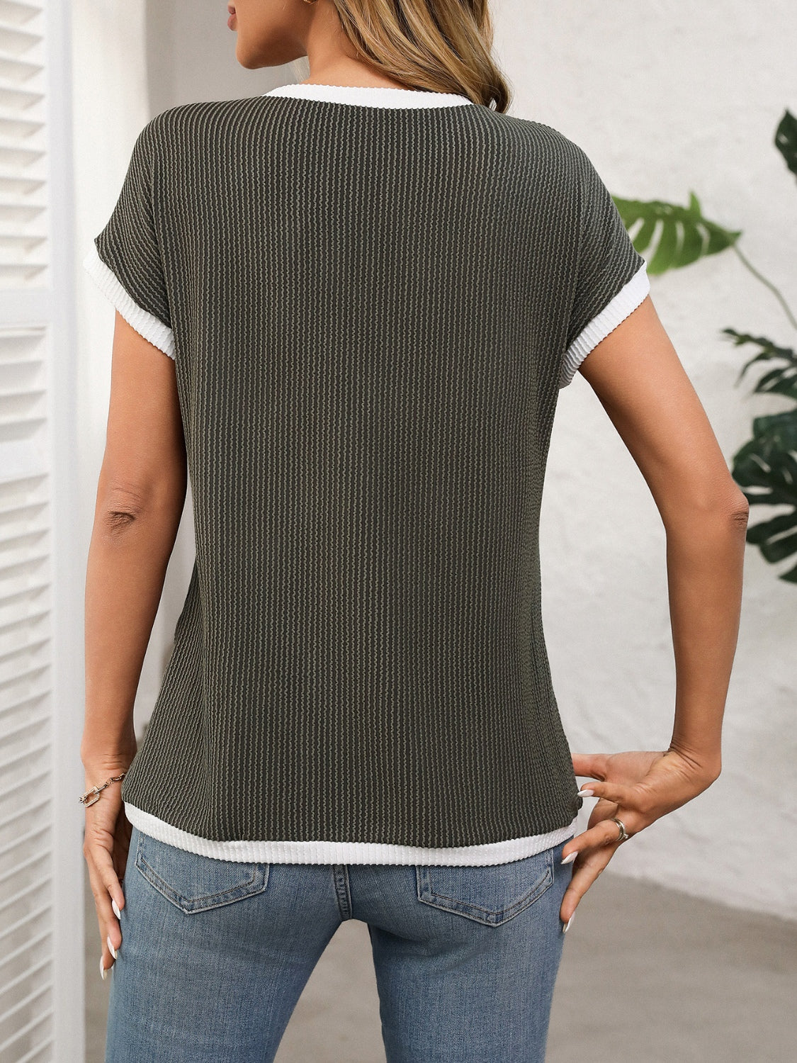 Army green ribbed knit tee with white contrast piping detail and short sleeves.
