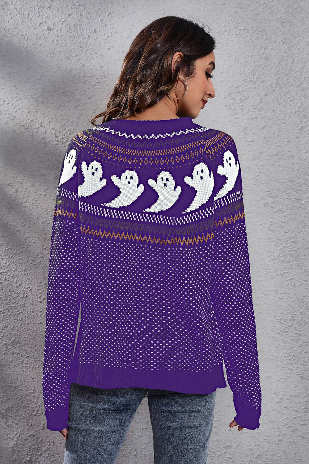 Purple crewneck sweater with ghost jacquard pattern and white dot accents.