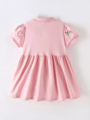 Pink cotton blend baby dress with embroidered heart and flower details on sleeves.