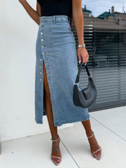 Button-front denim midi skirt in light wash with a high slit and silver buttons.