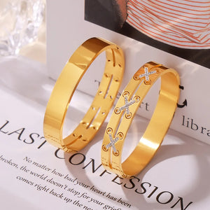 Gold cuff bracelets, one plain, one with diamond laced detail.