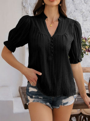 Black textured puff sleeve blouse with button-down front and V-neck.