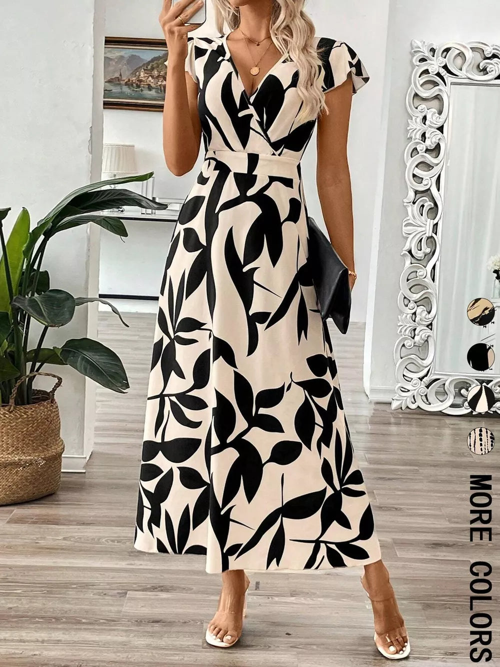 Floral print midi dress with cap sleeves and a-line cut in black and cream.