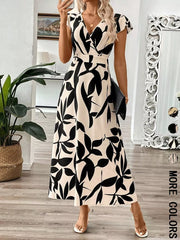 Floral print midi dress with cap sleeves and a-line cut in black and cream.