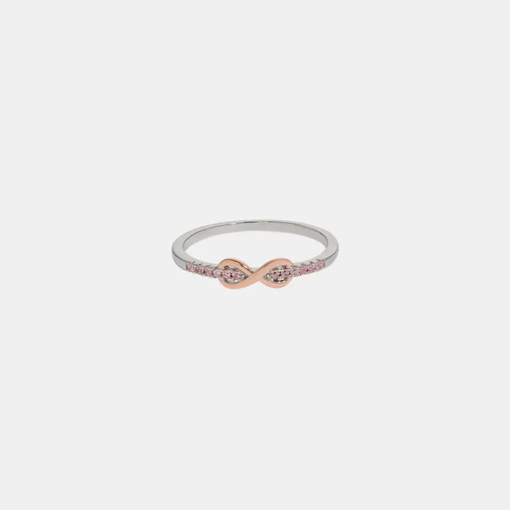 Infinity knot ring with pink stones and silver band
