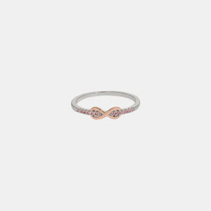Infinity knot ring with pink stones and silver band
