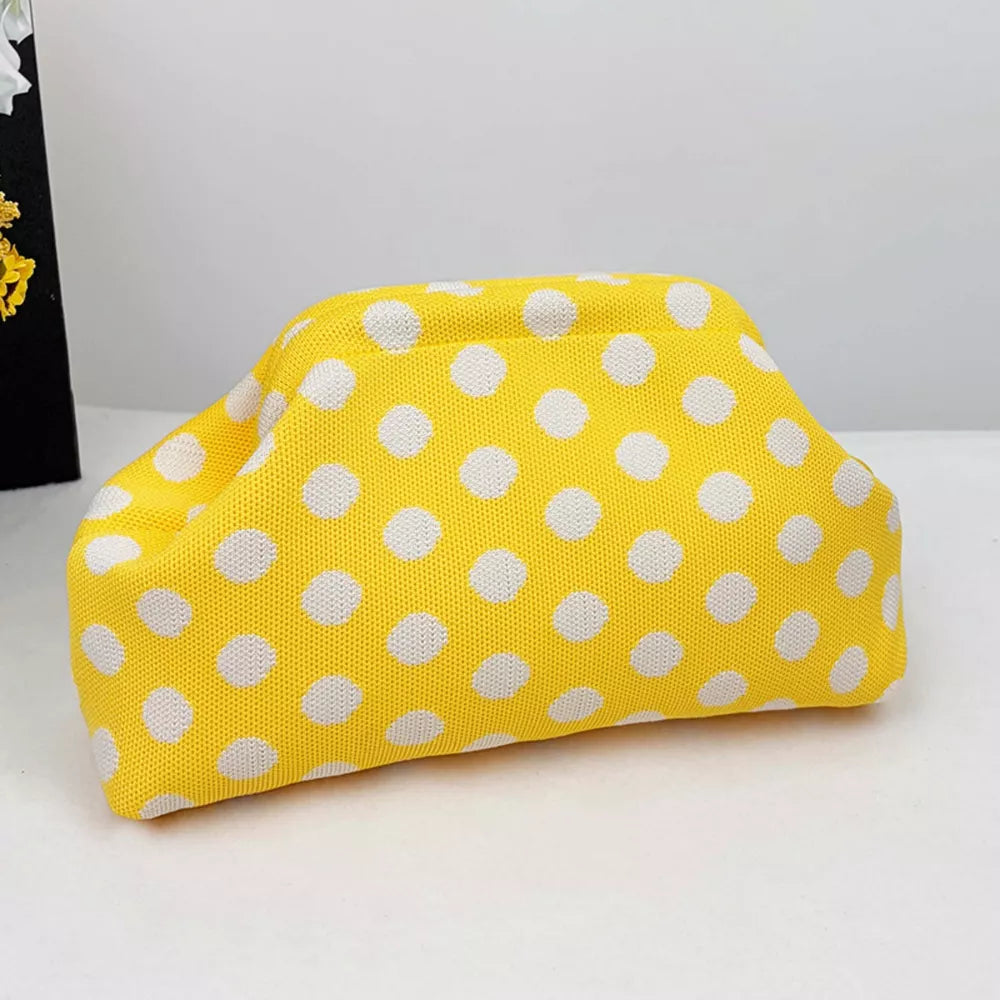Yellow polka dot knit clutch bag with white dots