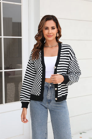 Black and white checkerboard sleeve contrast cardigan with button front and striped body.