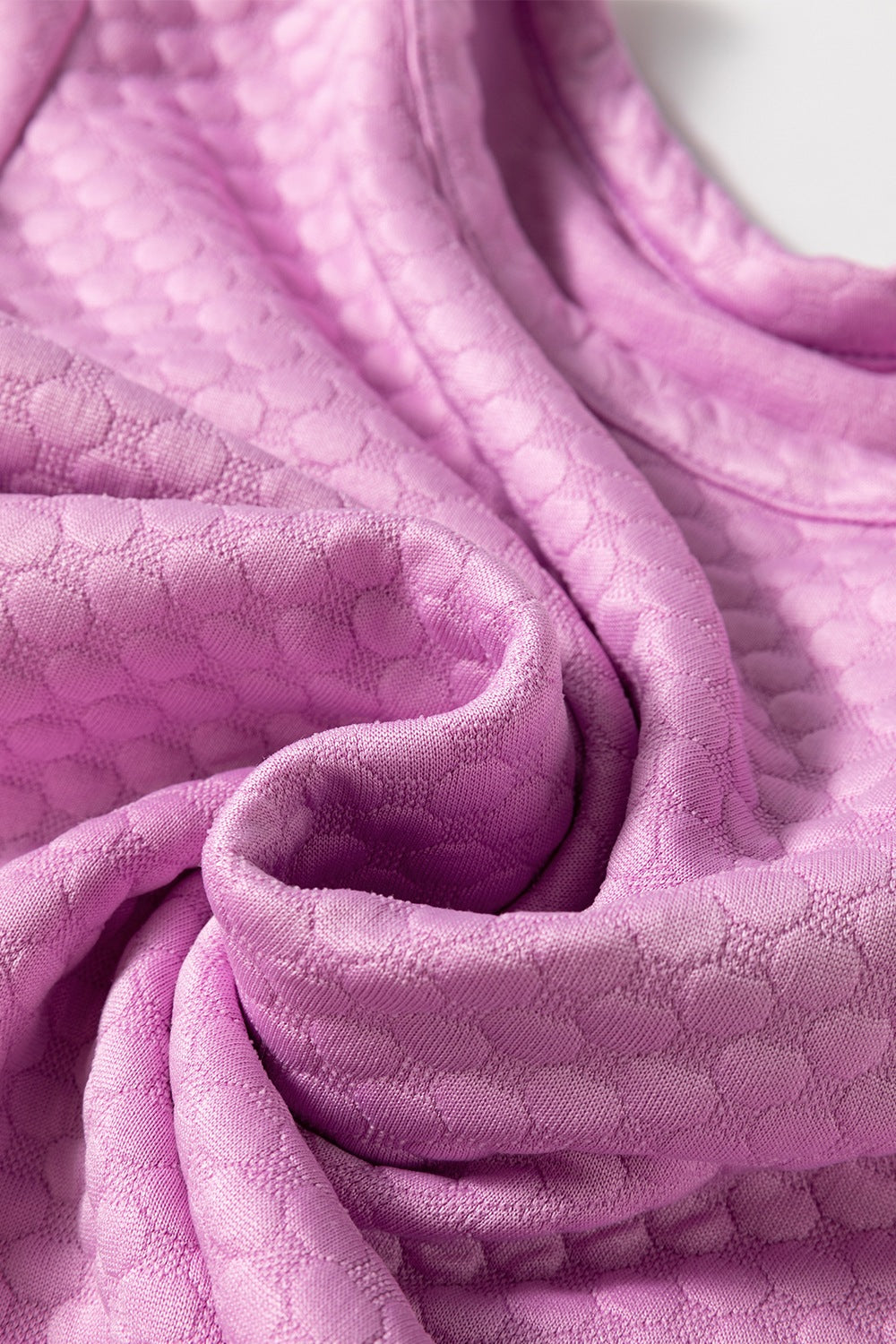 Pink purple textured quilted blouse with puff sleeves.