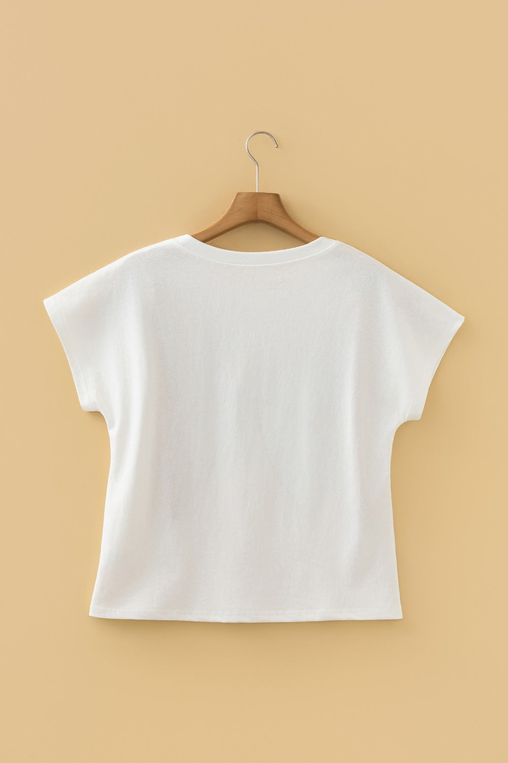 White cotton crew neck t-shirt with short sleeves and a graphic print on the front.