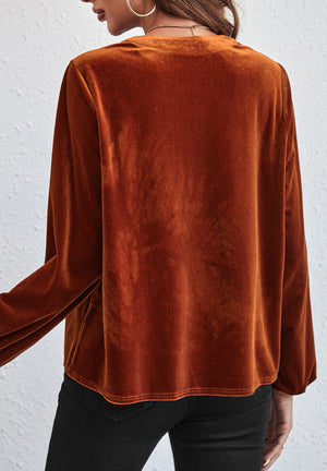 Gathered velvet henley blouse in brown with long sleeves.