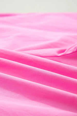 Pink chino shorts with a textured fabric detail.