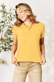 Yellow crew neck tee with short sleeves and a slit hemline, made of bamboo fabric.