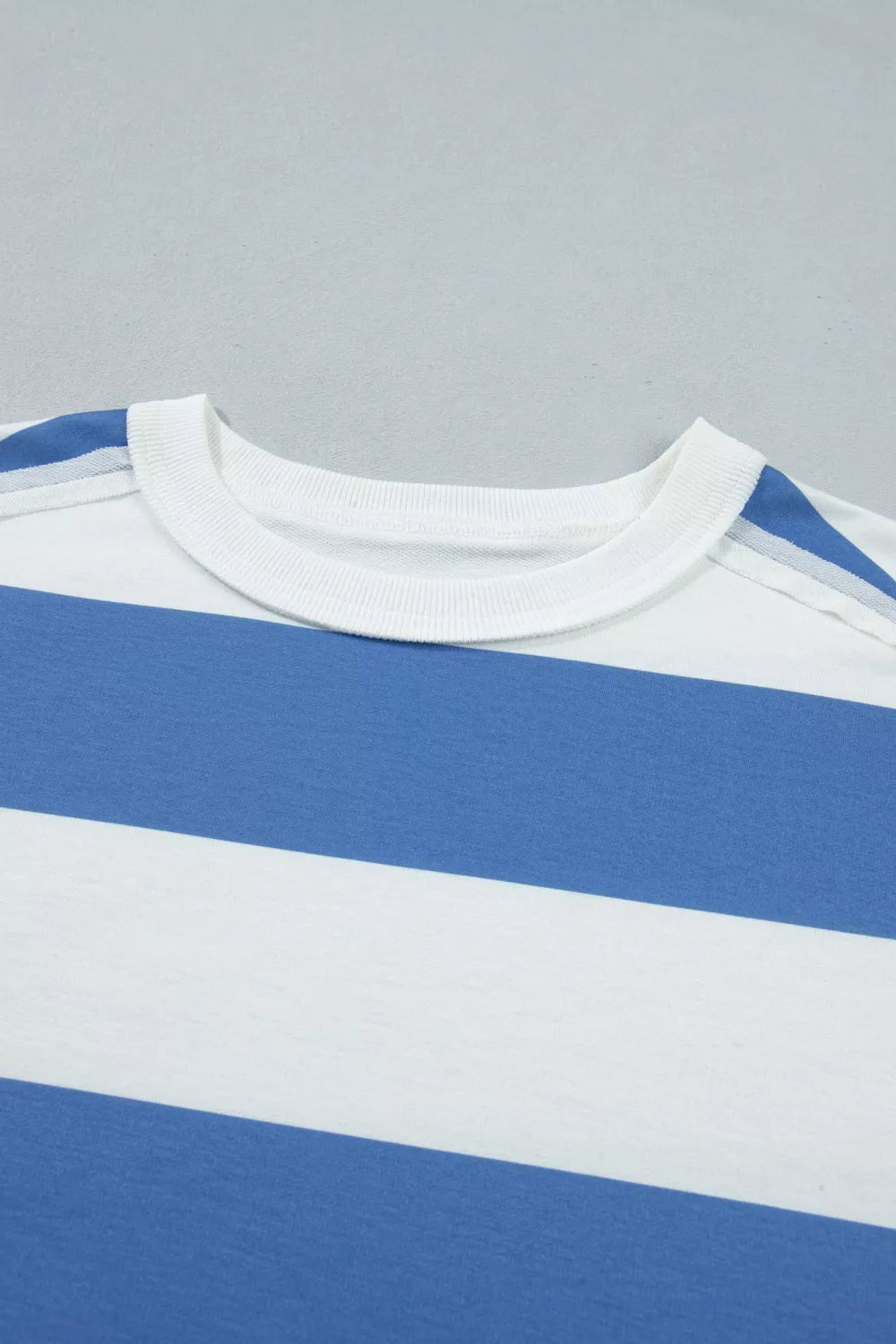 T-shirt dress with blue and white horizontal stripes and crew neck.
