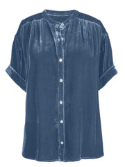 Dusty blue velvet button-down blouse with mandarin collar and cuffed short sleeves.