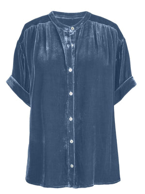 Dusty blue velvet button-down blouse with mandarin collar and cuffed short sleeves.