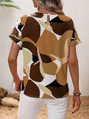 Women's abstract floral print tee in brown, camel, and black with short sleeves and a keyhole back detail.