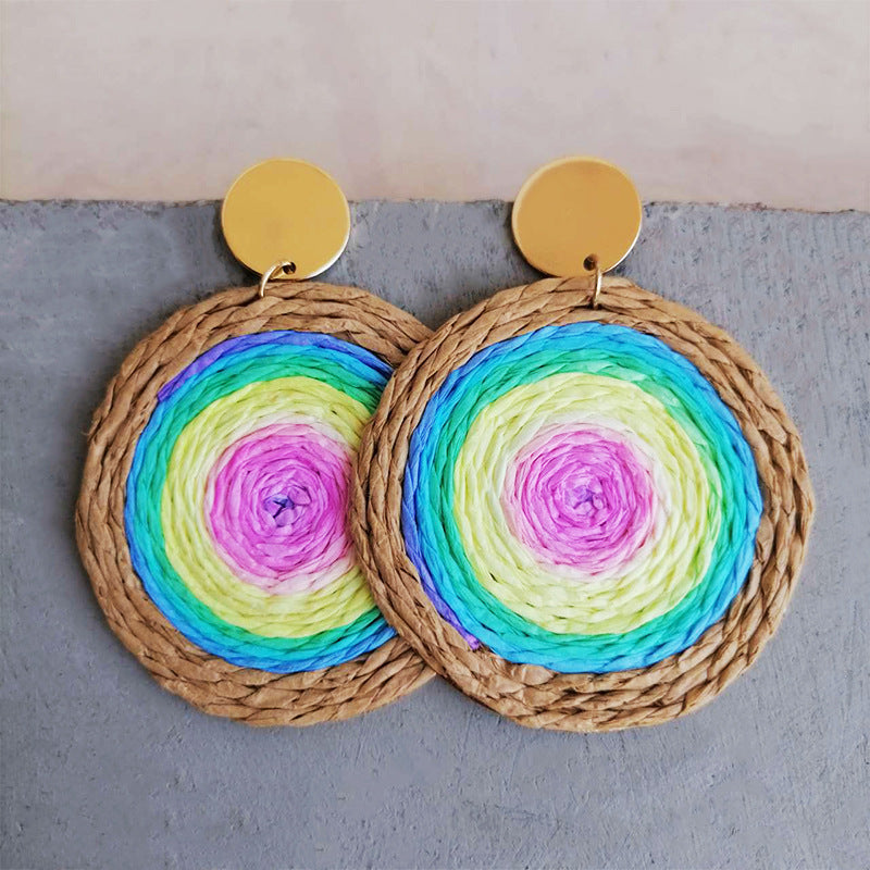 Raffia teardrop statement earrings with multicolor woven center and gold disc top
