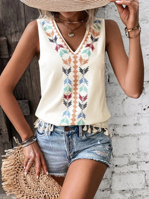 Cream embroidered V-neck tank top with colorful geometric pattern and tassel trim