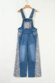 Denim overalls with vintage floral print panels on the bib and side seams.