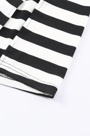 Black and white striped jersey maxi dress detail showing hem and stitching.