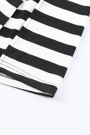 Black and white striped jersey maxi dress detail showing hem and stitching.