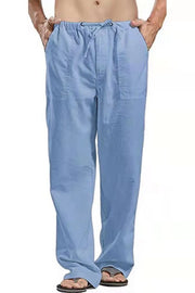Light blue linen drawstring trousers for men with a relaxed fit and side pockets.