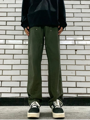 Army green relaxed fit cargo pants with utility details and silver button accents.