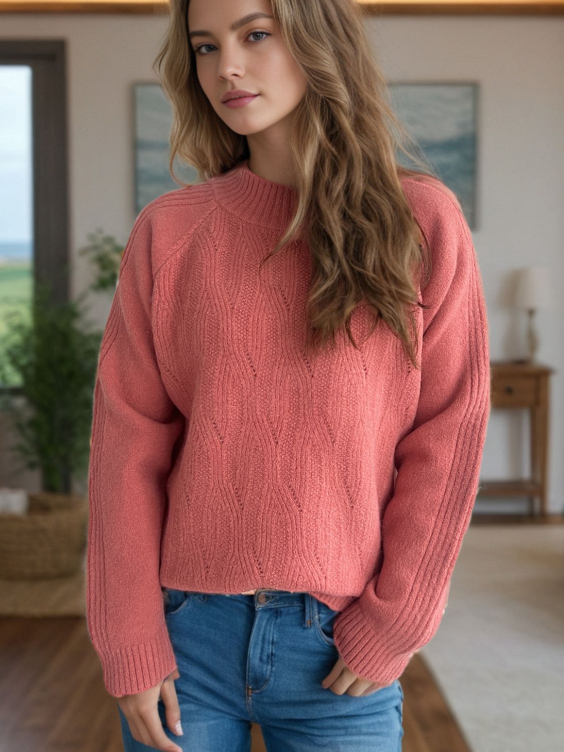 Textured knit raglan sleeve pullover in burnt coral with mock neck and diamond pattern.