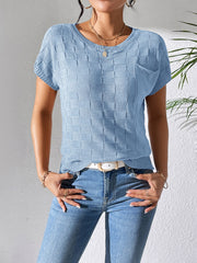 Light blue knit pocket tee with textured checkerboard pattern and short sleeves.