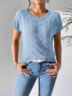 Light blue knit pocket tee with textured checkerboard pattern and short sleeves.