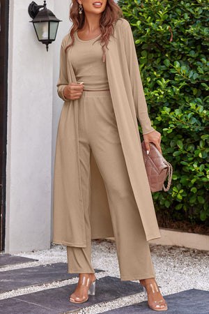 Tan ribbed knit duster, crop top, and wide-leg pants lounge set.