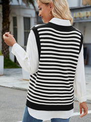 Striped knit v-neck vest in black and white acrylic with side slits.