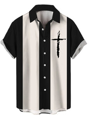 Button-up shirt with black and cream vertical stripes and a black cross graphic on the chest.