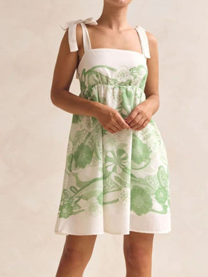 Green floral tie-strap mini dress with square neckline and pockets