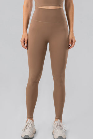 Camel high-waist performance leggings with a seamless contour fit.