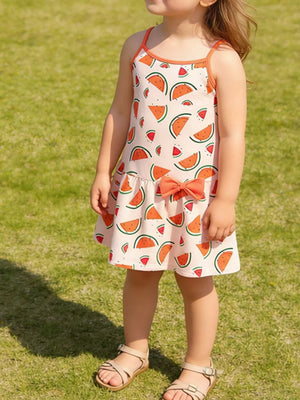 Toddler sundress with watermelon print, orange bow detail, and spaghetti straps.