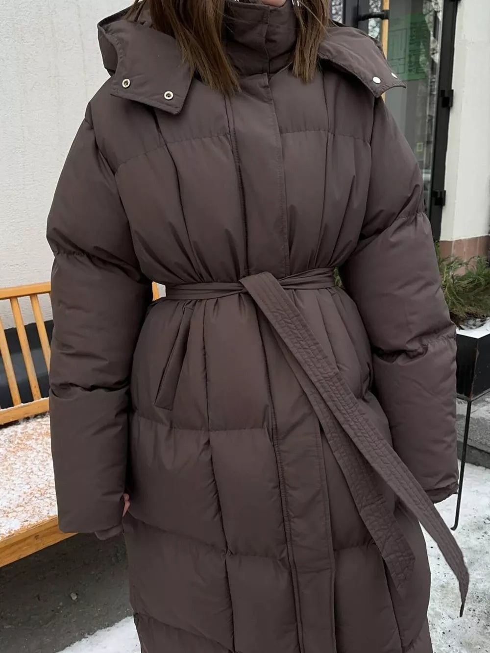 Chic padded trench coat in dark brown with a tie-belt and hood.