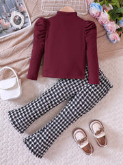 Baby girl's wine red ribbed top with puff sleeves and houndstooth pants.