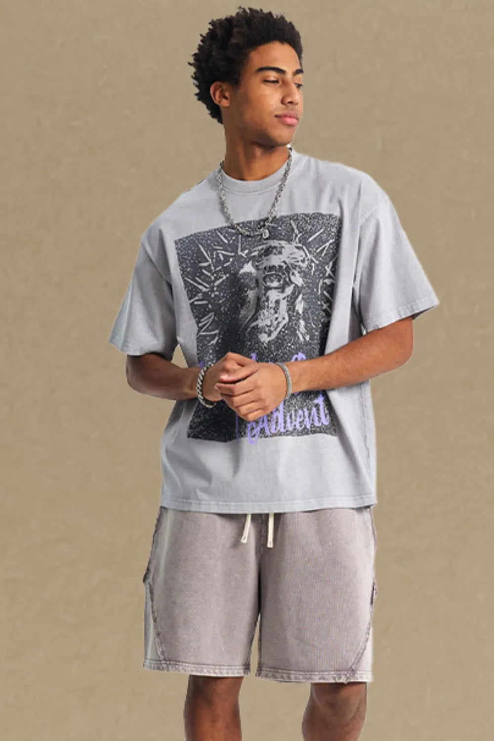 Gray oversized graphic tee with a distressed print and crew neck.